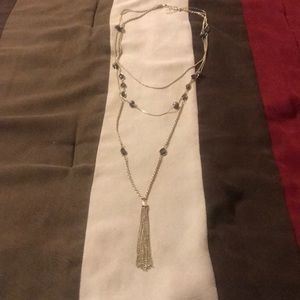 Gold/brown necklace w/gold tassels. 22 in long